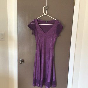 Flowy purple formal dress with paneling detail